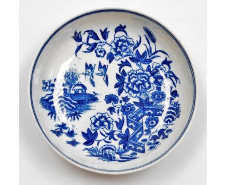 A first period Worcester porcelain circular dish, in blue and white decorated with zig-zag Fence pattern, birds and buildings