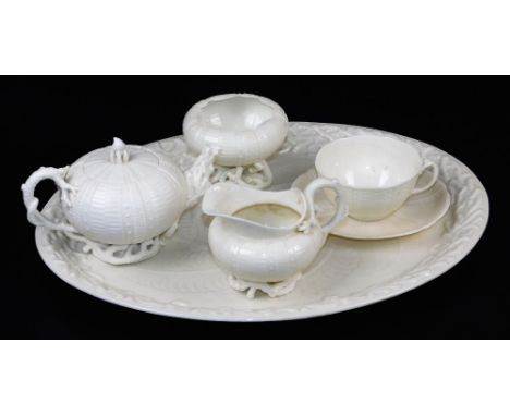 A first period Belleek Echinus solitaire set, comprising tray, teapot and cover, creamer, sugar, cup and saucer, black mark a