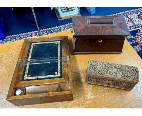 A Victorian mahogany tea caddy, a Victorian walnut writing slope and a carved Anglo Indian box (3).
