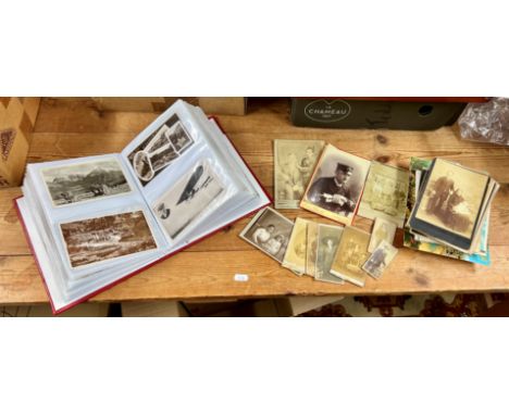 A small collection of postcards to include black and white portrait postcards, military and modern etc.
