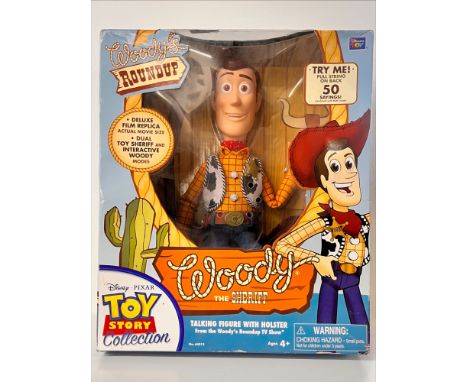 A Disney Pixar's 'Toy Story' talking figure of Woody the Sheriff, 'Woody's Roundup' tv show deluxe film replica, with hat and