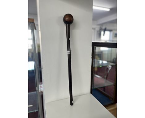 A carved hardwood Knobkerrie, length 64cm.