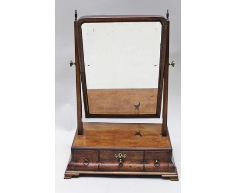 A GEORGE III MAHOGANY BOX BASE DRESSING TABLE MIRROR, the moulded frame contains a bevelled glass, the base fitted with three