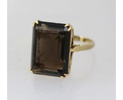 A LADY'S 9CT GOLD RING SET set with large smoky quartz, size Q 