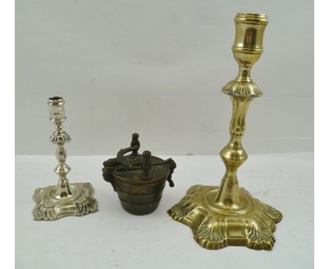 A LATE GEORGE III BRASS CANDLESTICK, having knopped stem on cast leaf base, 21cm high, together with a GEORGIAN TAPER STICK, 