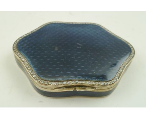A FRENCH ENAMEL SILVER PILL BOX having blue guilloche enamel hinged cover, set to the border with seed pearls, 6.8cm across, 