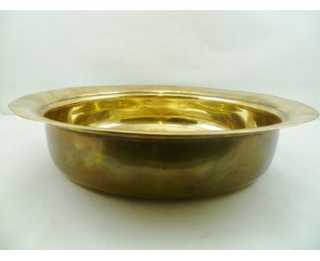 A 19TH CENTURY BRASS LAVER (OR BASIN), having turned over rim, evidence of hammering to under the rim and the domed base, 46.
