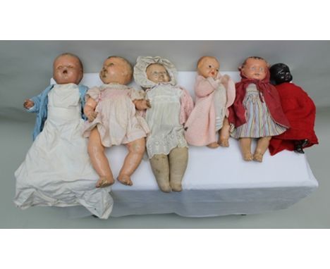 SIX VARIOUS DOLLS; Pedigree baby doll, 20" dressed in blue coat and nightdress, an unmarked doll in pink Pedigree dress, a cr