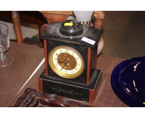 A late Victorian black slate and marble single hole mantel clock