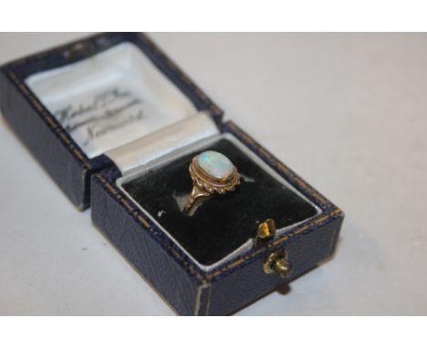 A 9ct gold opal set ring