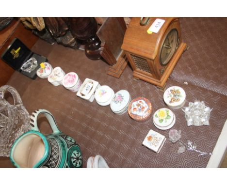 A collection of various china trinket boxes; a small Max Jonasson glass paperweight etc.