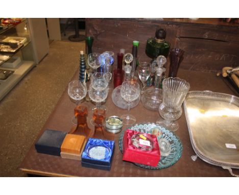 A quantity of various coloured and clear glassware; and an oil lamp