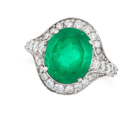 AN EMERALD AND DIAMOND CLUSTER RING set with an oval cut emerald of 6.64 carats in a cluster of round cut diamonds with furth