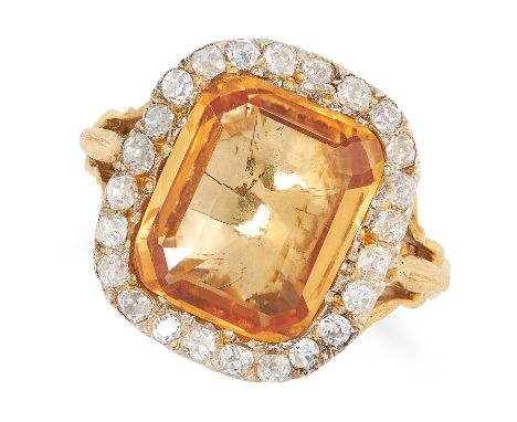 AN ANTIQUE IMPERIAL TOPAZ AND DIAMOND CLUSTER RING in high carat yellow gold, set with a cushion cut topaz of 5.62 carats in 