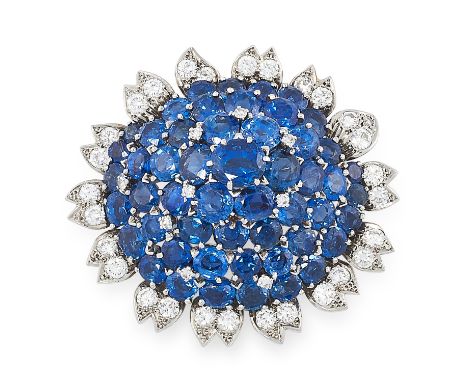 A VINTAGE SAPPHIRE AND DIAMOND BROOCH, CARTIER CIRCA 1960 in 18ct white gold, set with a cluster of round and oval cut sapphi