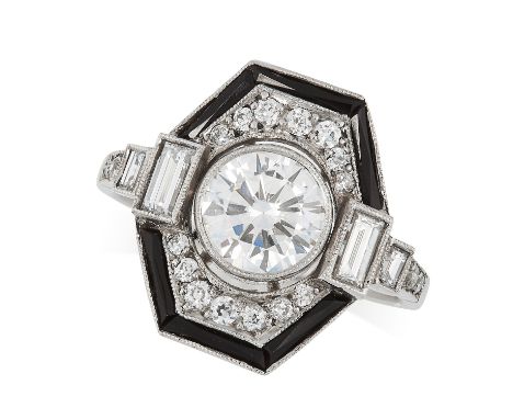 A DIAMOND AND ONYX DRESS RING in Art Deco design, set with a round cut diamond of 1.05 carats in a border of round and baguet