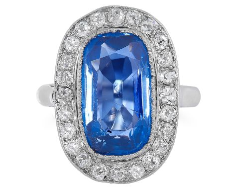 AN ART DECO 4.40 CARAT KASHMIR SAPPHIRE AND DIAMOND RING in palladium, set with a cushion cut sapphire of 4.40 carats in a bo