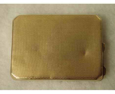 A 9ct gold Card Case of hinged rectangular form with canted corners, engine turned surfaces, 31.3g, 6.2cm x 4.5cm