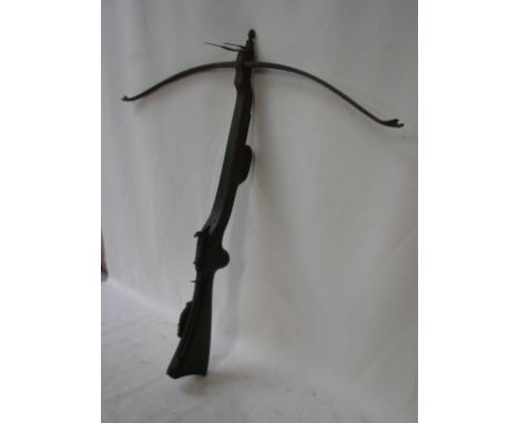 An early 20th century Poachers Crossbow / Stonebow, mahogany stock with steel mounts and action, pitch fork pattern front sig