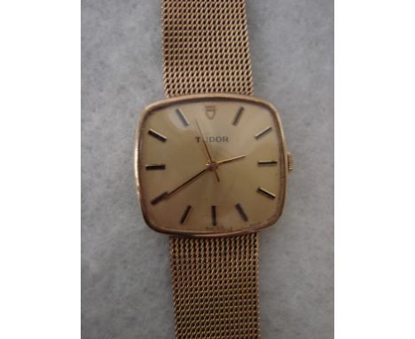 A 9ct gold Gentleman’s Tudor wrist watch, rounded square face, gilt dial with baton markers, centre seconds, signed Tudor Swi