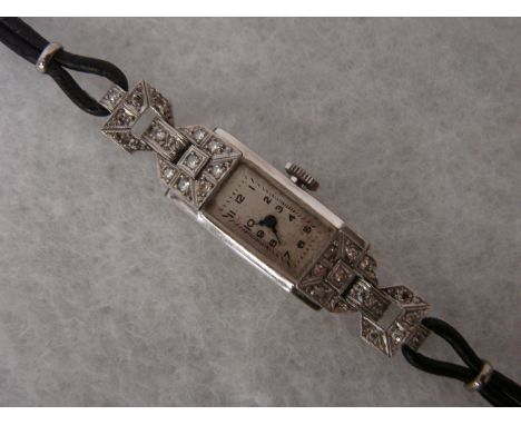 An Art Deco ladies cocktail watch, rectangular platinum case set with diamonds, Swiss made 16 jewel manual wind movement, sil