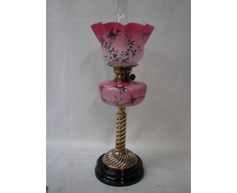 A good Victorian Oil Lamp, frilled graduated pink glass shade hand painted with birds and insects with conforming glass reser