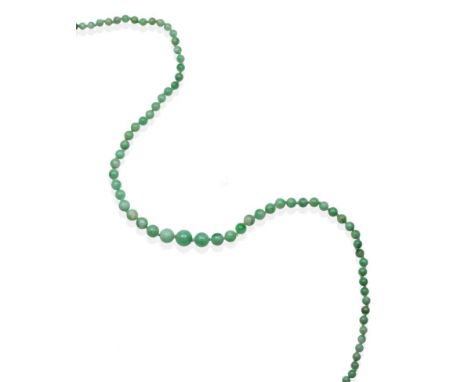 A Jade Necklace, graduated jade beads knotted to a ball clasp, length 67cm see illustration  .  The necklace is in good condi