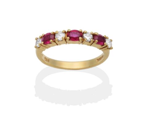 An 18 Carat Gold Ruby and Diamond Half Hoop Ring, oval cut rubies spaced by round brilliant cut diamonds in claw settings, to