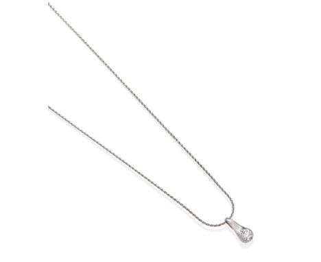 A Solitaire Diamond Pendant, on an 18 Carat White Gold Chain, a round brilliant cut diamond in a claw setting, to a drop fram