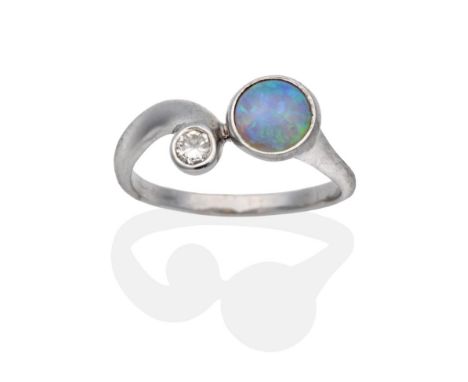 A 9 Carat White Gold Opal and Diamond Ring, a round cabochon opal and a round brilliant cut diamond in rubbed over settings, 