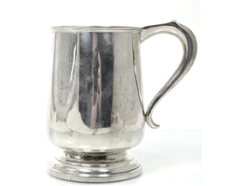 A Silver Mug, A & J Zimmerman, Birmingham 1938, retailed by Beaver Ltd, Manchester, plain with tucked in base on circular foo