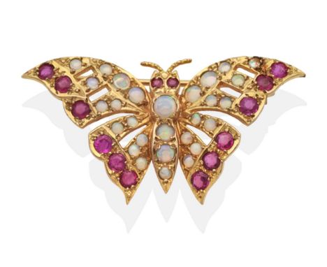 A 9 Carat Gold Opal and Ruby Butterfly Brooch, set throughout with round cabochon opals and round cut rubies, measures 2cm by