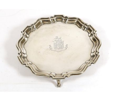 An Edwardian Silver Salver, Hukin & Heath, London 1906, shaped circular on three scroll supports, the centre engraved with an