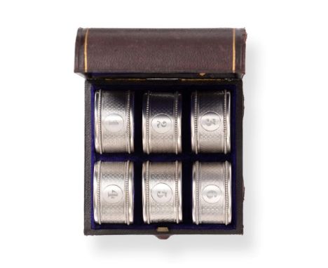 A Set of Six Victorian Silver Napkin Rings, William Summers, London 1877, with engine turned decoration and bead borders, num