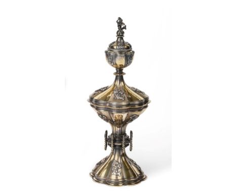 A Silver Gilt Cup and Cover, Ollivant & Botsford, London 1931, of lobed form in the Gothic taste, the alternate panels applie