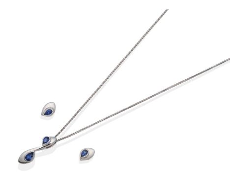 An 18 Carat White Gold Sapphire Pendant and Earring Suite; the pendant with two pear cut sapphires in rubbed over settings to