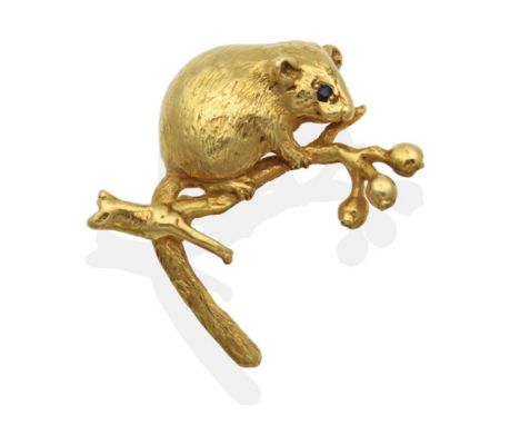 An 18 Carat Gold Harvest Mouse Brooch, by Harriet Glen, realistically modelled with textured fur, a sapphire set eye and clim