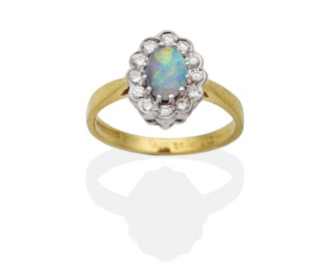 An 18 Carat Gold Opal and Diamond Cluster Ring, an oval cabochon opal in a claw setting within a border of round brilliant cu