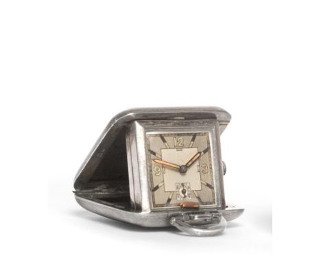 An Art Deco Silver Travelling Timepiece, maker's mark SSM, Birmingham 1936, with engine turned decoration and sprung hinge, t