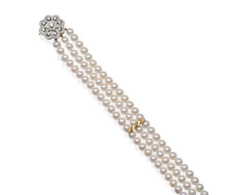 An 18 Carat Gold Triple Strand Cultured Pearl Choker, with a Diamond Clasp, uniform cultured pearls with two fluted bar links