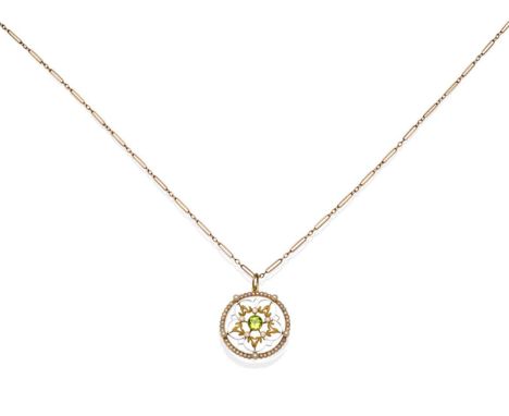 An Early Twentieth Century Peridot and Seed Pearl Pendant, on Chain, a round cut peridot in a milgrain setting within a circu