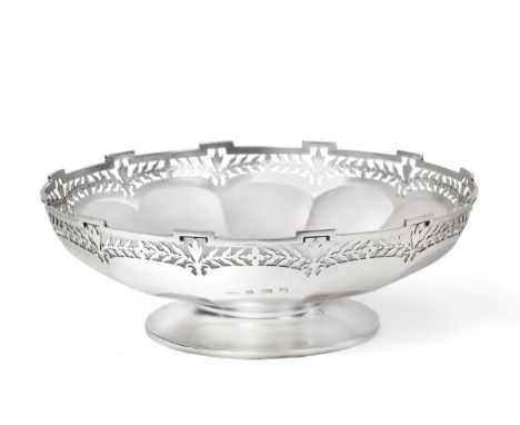 A George V Silver Bowl, Edward Souter Barnsley , Birmingham 1912, the shaped rim pierced with foliage, panelled sides and on 
