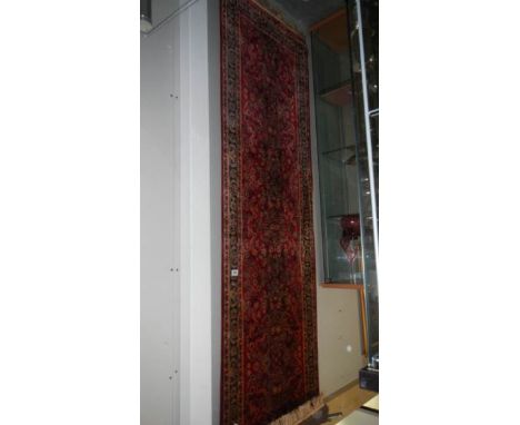 A red patterned carpet runner