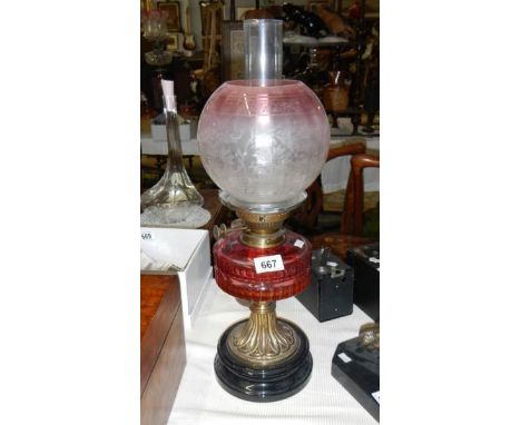 A Victorian ruby oil lamp with cranberry glass vessel & etched shade, in good condition