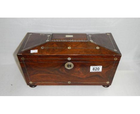 A mahogany tea caddy