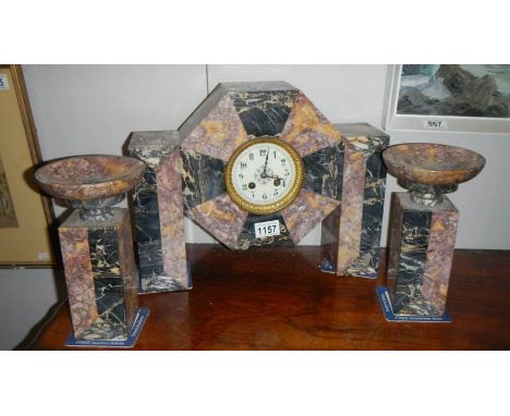 A 3 piece French marble clock garniture