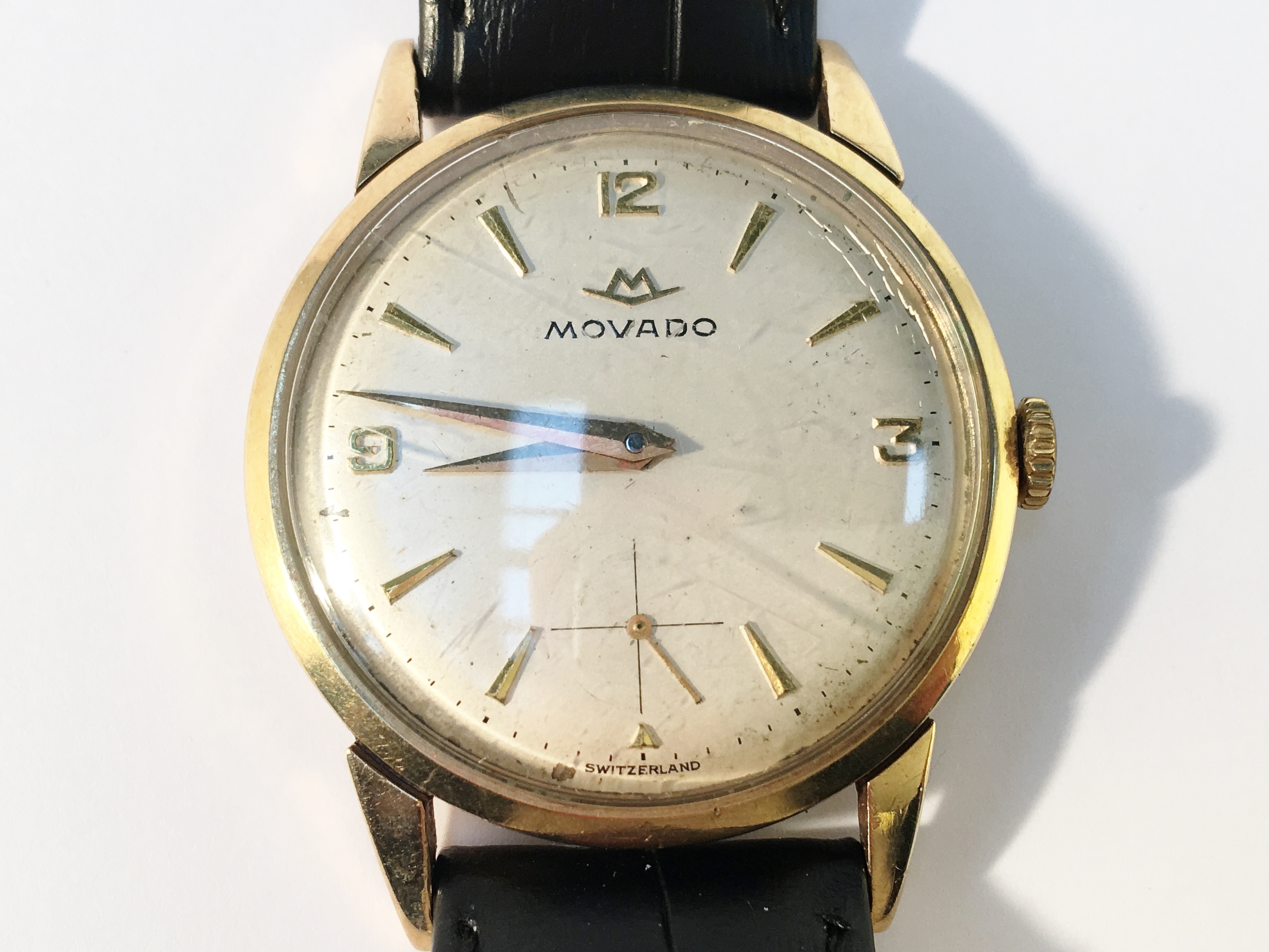 A vintage Movado gentleman's gold wrist watch, in working order