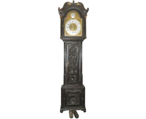A carved oak brass faced Grandfather clock in working order