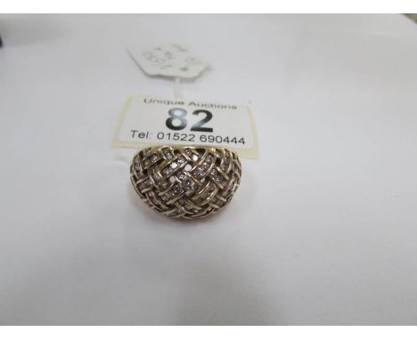 An 11.6 gram yellow gold fretwork pattern diamond ring, size K