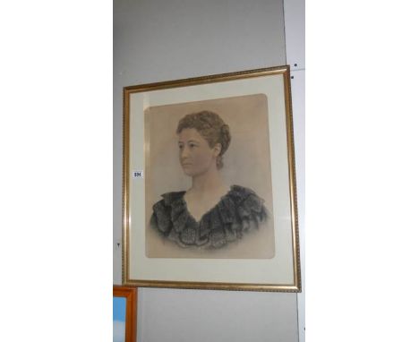 A framed and glazed portrait of a lady